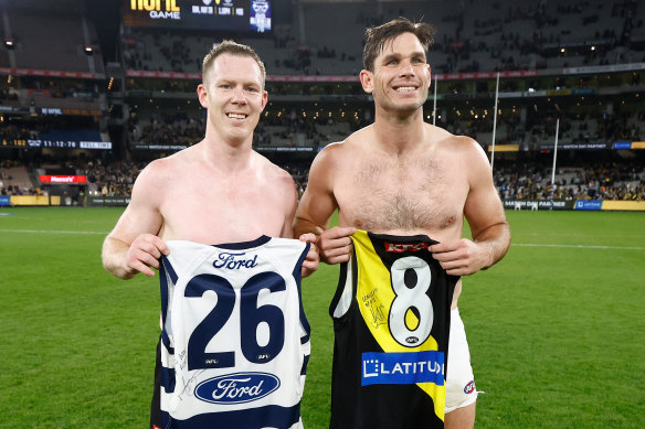 Tiger Jack Riewoldt and Cat Tom Hawkins with each other’s guernseys after Friday night’s match.