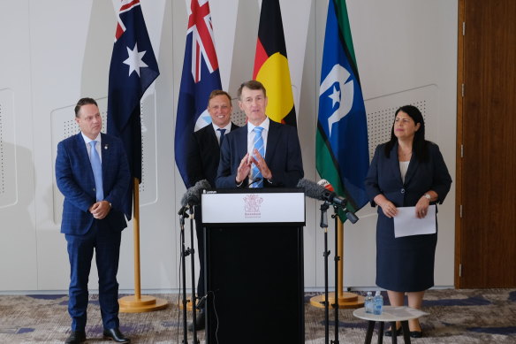 Former Brisbane lord mayor Graham Quirk speaks at a press conference fronted by Premier Steven Miles (second from left), Lord Mayor Adrian Schrinner and Grace Grace.