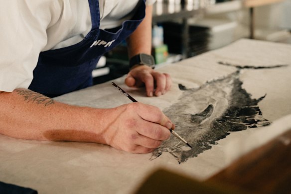 All in the detail – lauded chef Ben Devlin takes a record of the fish before preparing it for the table.