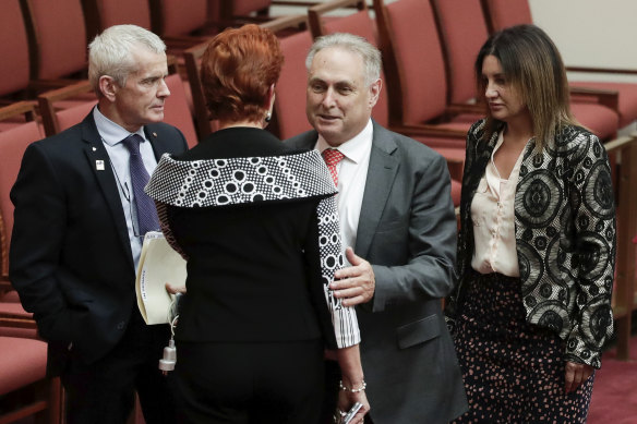 Labor's Senator Don Farrell with One Nation senators Malcolm Roberts and Pauline Hanson, and Jacqui Lambie after the Ensuring Integrity Bill was defeated.