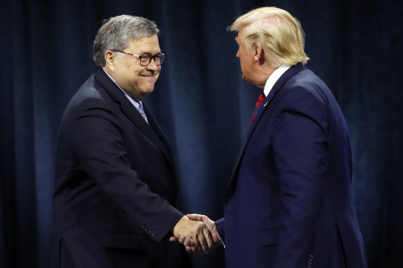 Like-minded: US President Donald Trump shakes hands with Attorney-General William Barr.