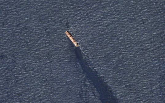 The Rubymar seen in the southern Red Sea near the Bay el-Mandeb Strait leaking oil after an attack.