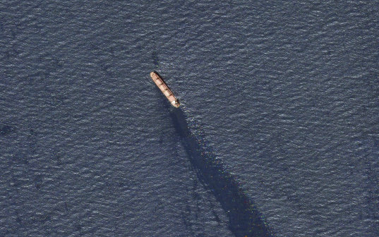The Rubimare ship is seen in the southern Red Sea near the Gulf of Mandab Strait, leaking oil after an attack.