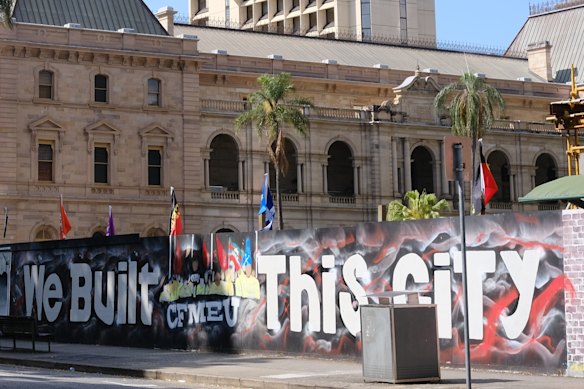 A CFMEU mural at the Queen’s Wharf construction site next to State Parliament.