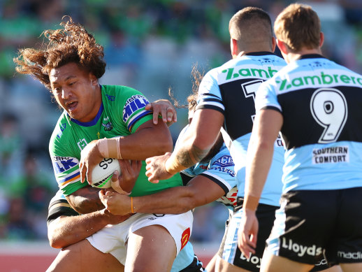 Josh Papalii makes a charge for the Raiders against the Sharks on Friday evening.