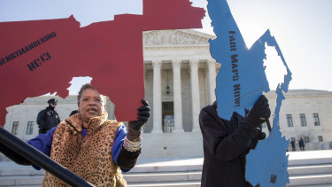 Activists gathered outside the US Supreme Court in March as it heard separate cases on gerrymandering and the census.