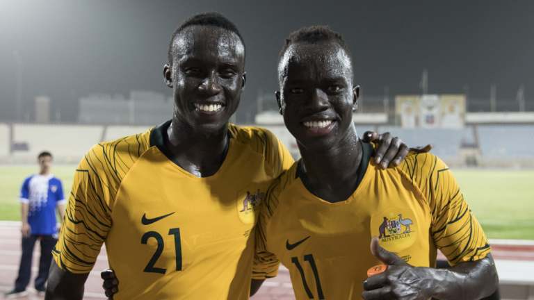 Awer Mabil (right), with Socceroos teammate Thomas Deng.