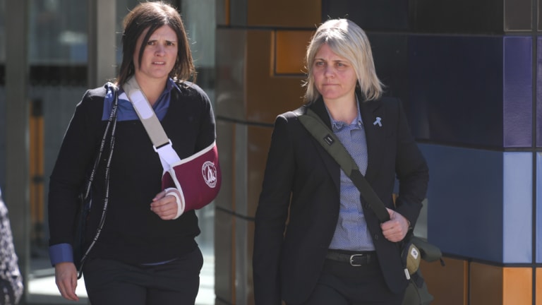 Emma-Kate McPherson , left, and her partner Kathryn Lee Richens at the Federal Court on Monday.