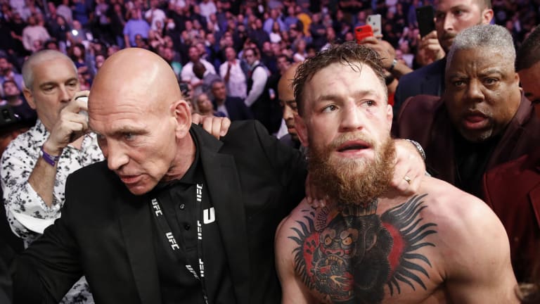 Conor McGregor was led away by security after the post-fight drama.
