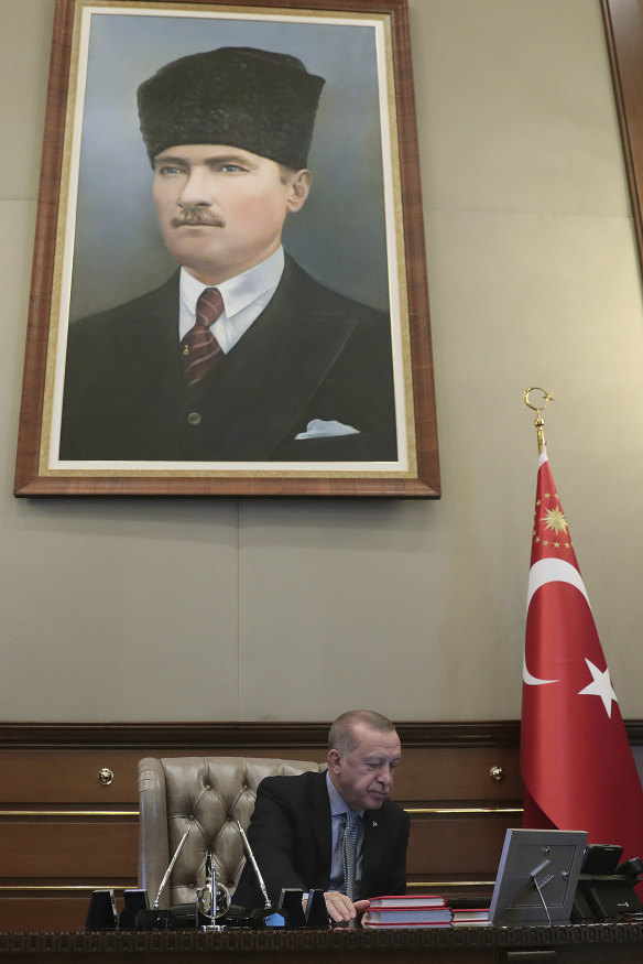 Turkey's President Erdogan, pointedly sitting under a portrait of Ataturk,  reportedly gives the orders to start the military operation on October 9.