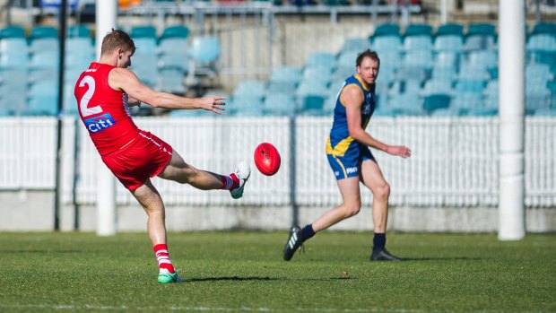 Alex Johnson kicks a goal in the NEAFL last July.