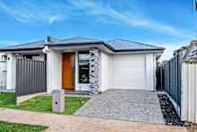 The three-bedroom, two-bathroom row dwelling/duplex at 89c Whitington Road in outer-northern Adelaide’s Davoren Park sold at auction for $730,000.