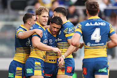  Isaiah Iongi celebrates with Eels teammates after scoring a try.