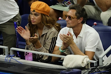 American soccer player Trinity Rodman, left, watchers her boyfriend Ben Shelton, of the United States, play Carlos Alcaraz, of Spain, in the quarterfinal round of the U.S. Open tennis championships