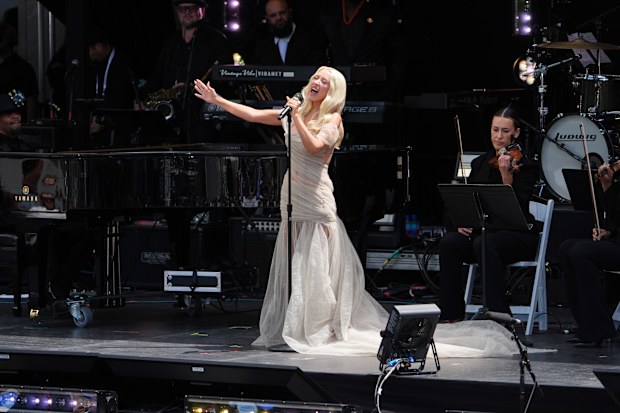 Christina Aguilera performed early during the dedication ceremony