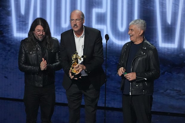 David Grohl, from left, Krist Novoselic, and Pat Smear of Nirvana accept the video vanguard award during the MTV Video Music Awards