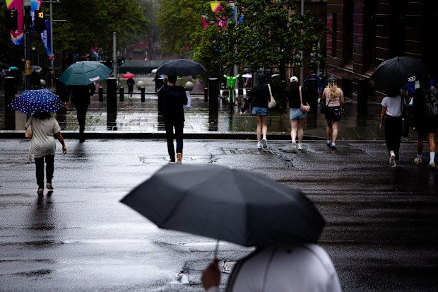 SMH FIRST USE: People walk through Sydney streets, near Martin Place Station, as rain falls in the morning. Sydney faces heavy rainfall throughout the end of the week and into the weekend. Friday, February 27th, 2026. Photo: Audrey Richardson, The Sydney Morning Herald.