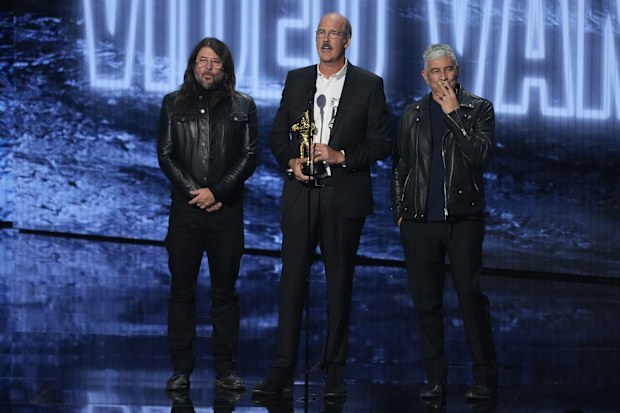 David Grohl, from left, Krist Novoselic, and Pat Smear of Nirvana accept the video vanguard award during the MTV Video Music Awards on Sunday, Sept. 27, 2026, at the Peacock Theater in Los Angeles. (AP Photo/Chris Pizzello)
