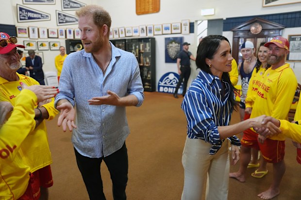 Meghan, Duchess of Sussex and Prince Harry, Duke of Sussex pose for a selfie photo as they meet volunteer first responders from Bondi Surf Bathers' Life Saving Club, during a visit to Bondi Beach, on day four of the royal trip to Australia on April 17, 2026 in Sydney, Australia. 