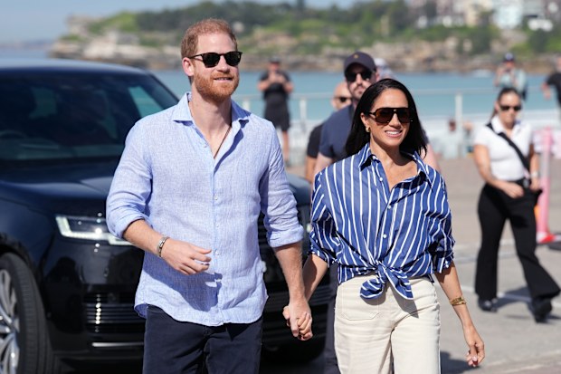 SYDNEY, AUSTRALIA - APRIL 17: Prince Harry, Duke of Sussex and Meghan, Duchess of Sussex arrive to meet volunteer first responders from Bondi Surf Bathers' Life Saving Club, during a visit to Bondi Beach, on day four of the royal trip to Australia on April 17, 2026 in Sydney, Australia. Volunteers from the organisation, founded in 1907, played an integral role in protecting beachgoers and saving lives during the terrorist attack at Bondi Beach on December 14. 