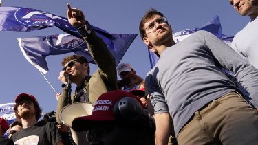 Right-wing podcaster Nick Fuentes, center, speaking to supporters of President Donald Trump during a pro-Trump march in November.