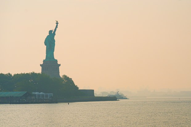 Normally the New York metropolitan area skyline is easily visible from the Statue of Liberty, but not right now.