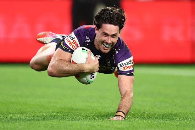 Storm star Nick Meaney scores against the Broncos.