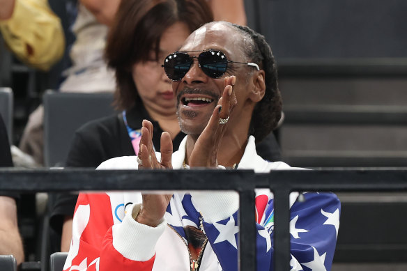 Snoop Dogg cheers during the gymnastics on day two at Bercy Arena.