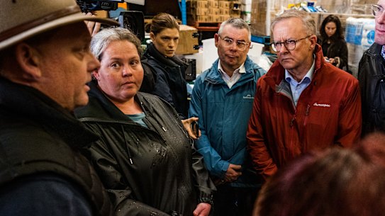 Australian prime minister Anthony Albanese, NSW Premier Dominic Perrottet, Federal Minister for Emergency Management Murray Watt and Steph Cooke - NSW Emergency  Services and Flood Recovery Minister visit Hawkesbury’s Helping Hands where perishables for flood victims are being pulled together for delivery. Photographed Wednesday 6th July 2022. Photograph by James Brickwood. SMH NEWS 220706 speaking with Scott Hinks - a Windsor  local - in Akubra hat. 