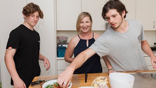 Karen Porter with her two boys Cameron Morris and Lachie Morris, at their Fairlight home where they share the chores. 