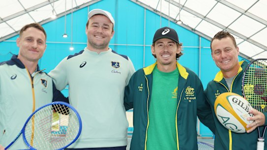 Wallabies Harry Wilson, and Corey Toole pose with Alex de Minaur and Lleyton Hewitt at Sydney Olympic Park Tennis Centre