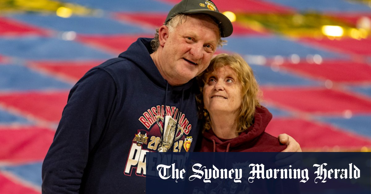 Two love stories 45 years in the making, writ large on Brisbane Lions grand final banner