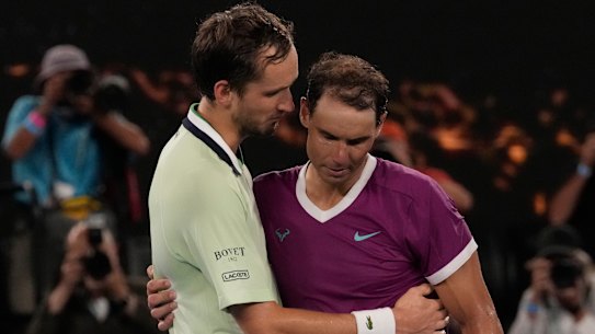 The players embrace at the end of the five-set thriller.