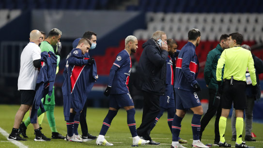 Players leave the pitch in the Champions League match between PSG and Basaksehir after anger at an alleged racial slur from a fourth official.