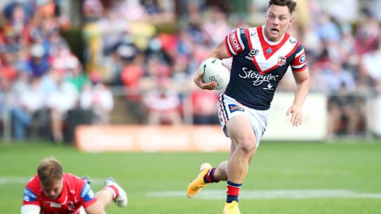Lachlan Lam makes a break for the Roosters.