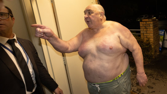 A shirtless man is refused entry to Liberal Party election party at Doncaster Bowls Club.   