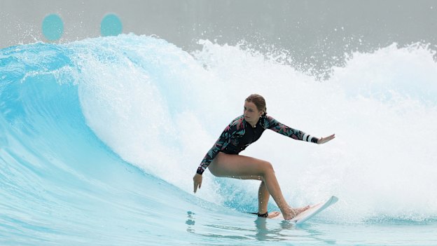 Ruby Trew surfs at URBNSURF, a surf park at Sydney Olympic Park.
