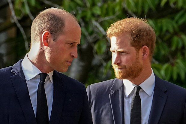 FILE - Britain’s Prince William and Britain’s Prince Harry walk beside each other after viewing the floral tributes for the late Queen Elizabeth II outside Windsor Castle, in Windsor, England on Sept. 10, 2022. (AP Photo/Martin Meissner, File)