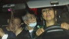 Alberto Fujimori, centre, is driven out of prison by one of his lawyers, accompanied by his son Kenji, left, after his release in December last year. 