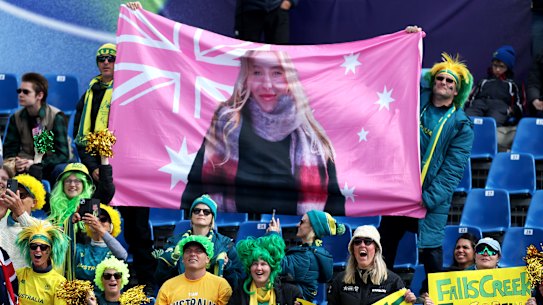 Liana France’s family with their custom flag made on strict instructions from the 16-year-old.