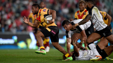 Justin Olam in full flight for PNG.