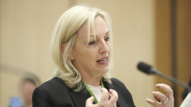 Australia Post chief executive Christine Holgate defended the decision to buy four Cartier watches for employees as a reward for brokering a deal with Australian banks at a Senate estimates hearing on Thursday.