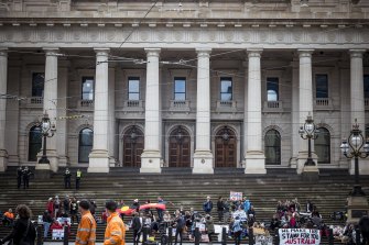 Protesters against Victoria’s proposed new pandemic laws gather outside Parliament.