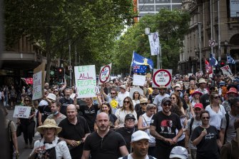 Thousands of anti-vaccination mandate protestors march through Melbourne’s CBD on Saturday.
