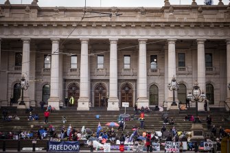 Protesters gather at Parliament House on Tuesday. 