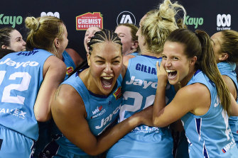 Liz Cambage and the Flyers celebrate their championship triumph.