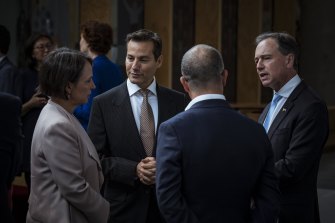 Moderna Australia and New Zealand managing director Michael Azrak (centre) speaks with federal Health Minister Greg Hunt and Victorian Minister for Innovation, Medical Research and the Digital Economy Jaala Pulford.