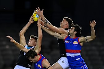 Mitch Georgiades and Peter Ladhams fly for a mark.