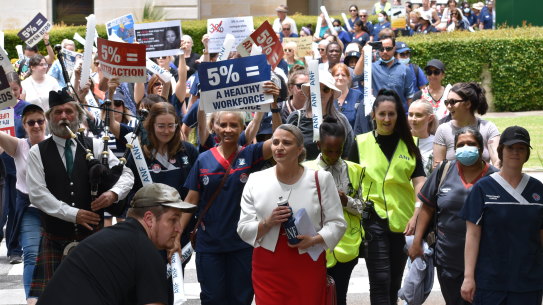 ANF secretary Janet Reah walks with protesters during a 2022 rally.