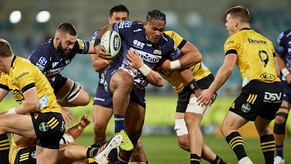Brumbies winger Solomone Kata tries to find his way through traffic against the Hurricanes in Canberra.